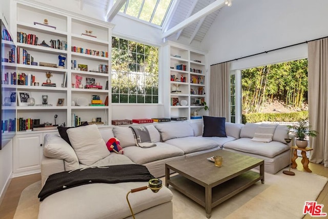 sunroom with vaulted ceiling with skylight