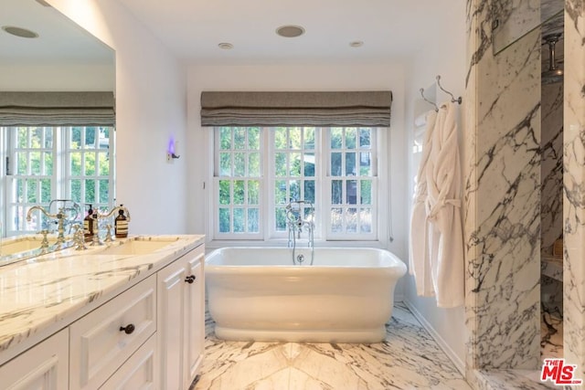 bathroom with independent shower and bath and vanity