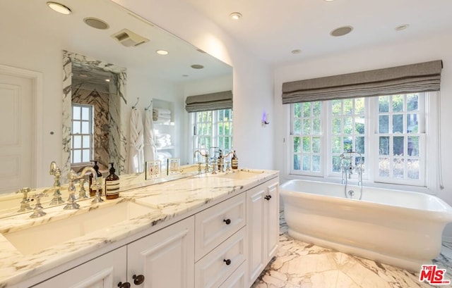 bathroom featuring vanity and a bathtub