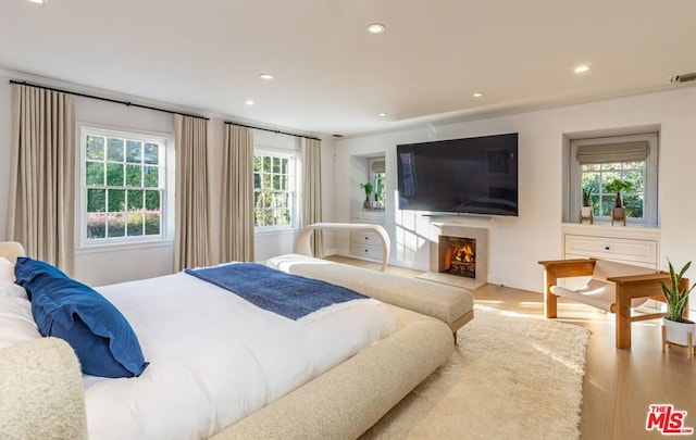 bedroom with light hardwood / wood-style floors