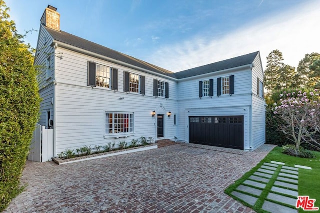 colonial house featuring a garage