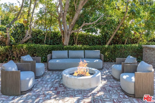 view of patio with an outdoor fire pit