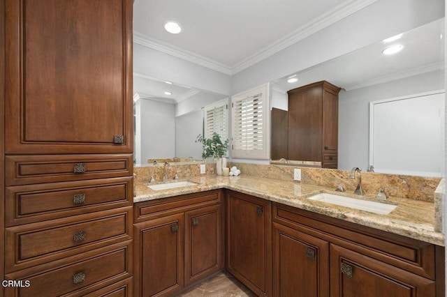 bathroom with vanity and ornamental molding