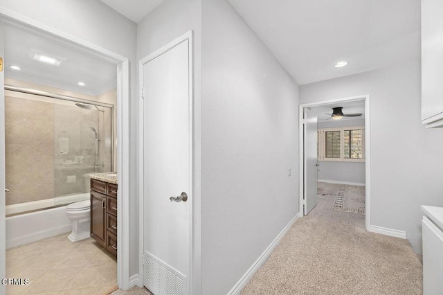 hallway with light colored carpet