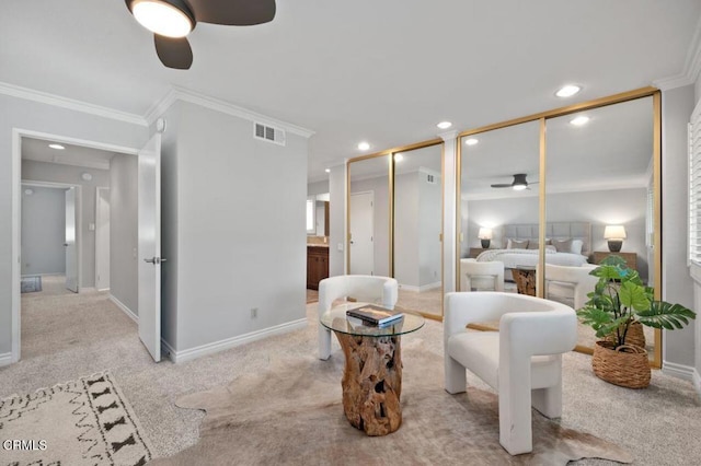 bedroom with crown molding, light colored carpet, and ceiling fan