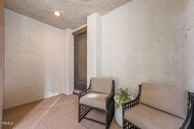 sitting room with tile patterned floors