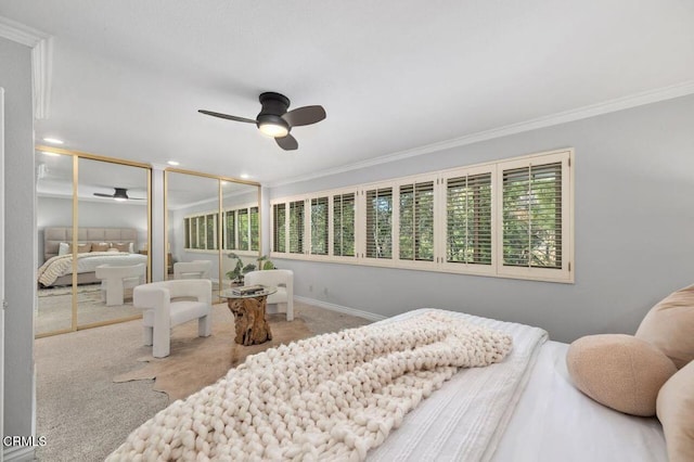 carpeted bedroom featuring ornamental molding and ceiling fan