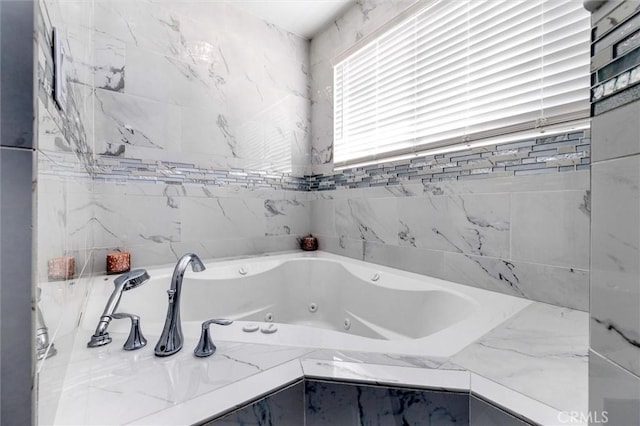 bathroom featuring a relaxing tiled tub