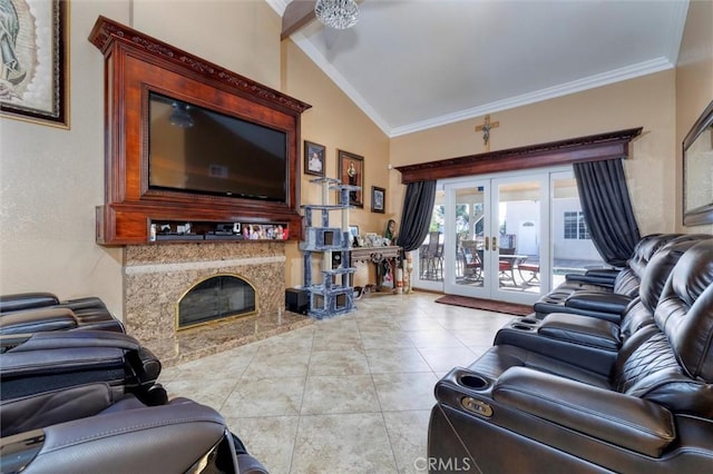 tiled living room with french doors, ornamental molding, a high end fireplace, and vaulted ceiling