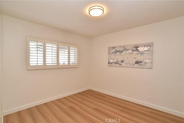 unfurnished room featuring wood-type flooring