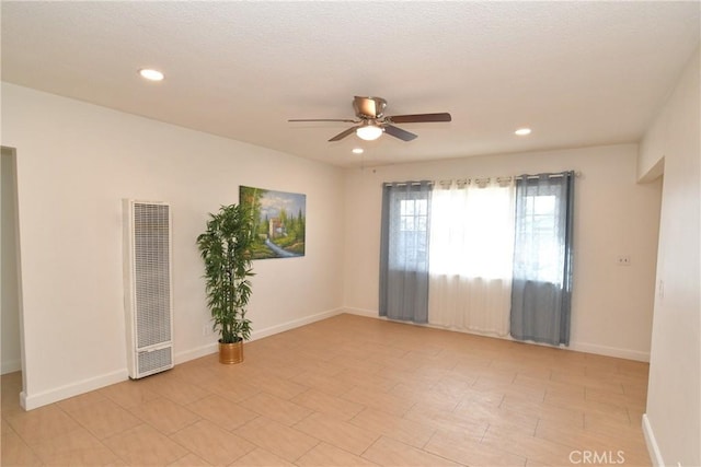 unfurnished room with ceiling fan