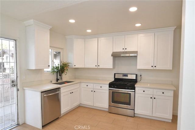 kitchen with white cabinetry, sink, and stainless steel appliances