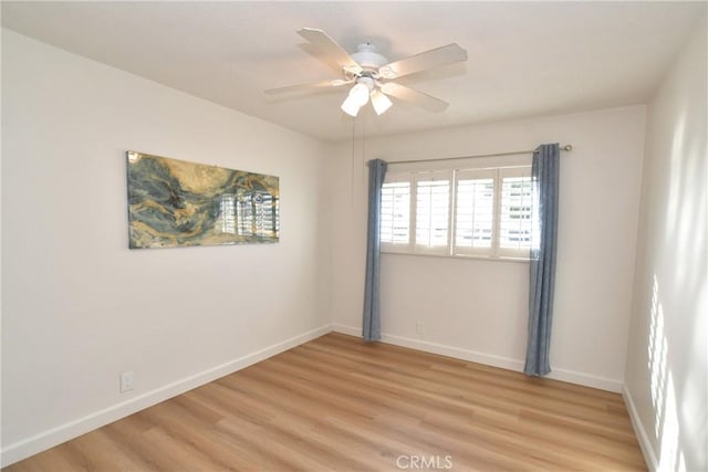 spare room featuring ceiling fan and light wood-type flooring