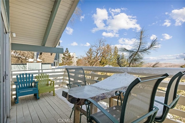 wooden balcony featuring a deck