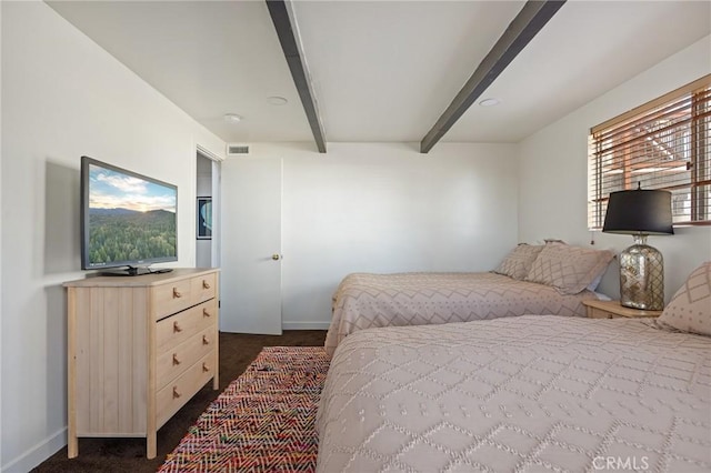 bedroom featuring beam ceiling