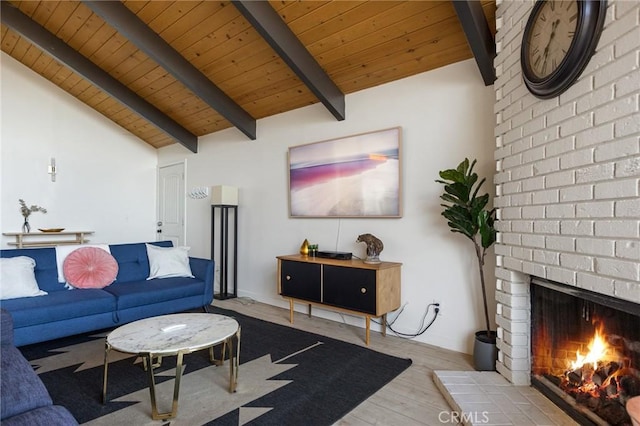 living room with hardwood / wood-style flooring, a fireplace, lofted ceiling with beams, and wooden ceiling