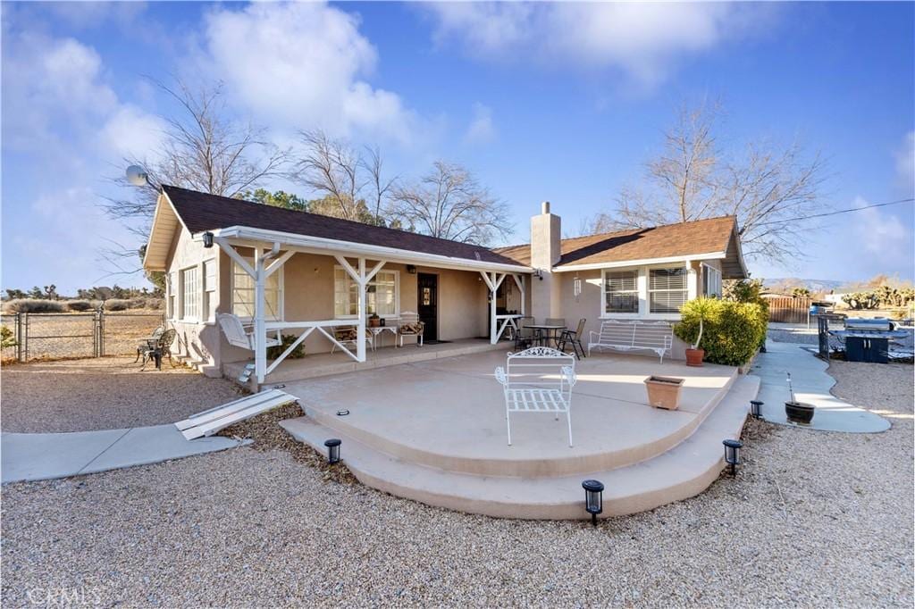 back of house with a patio area