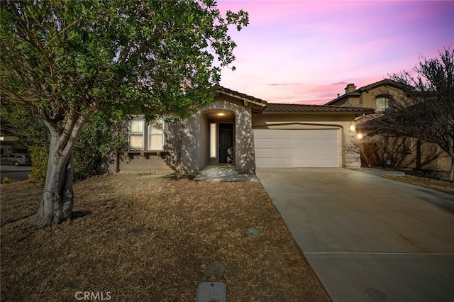 view of front of property featuring a garage