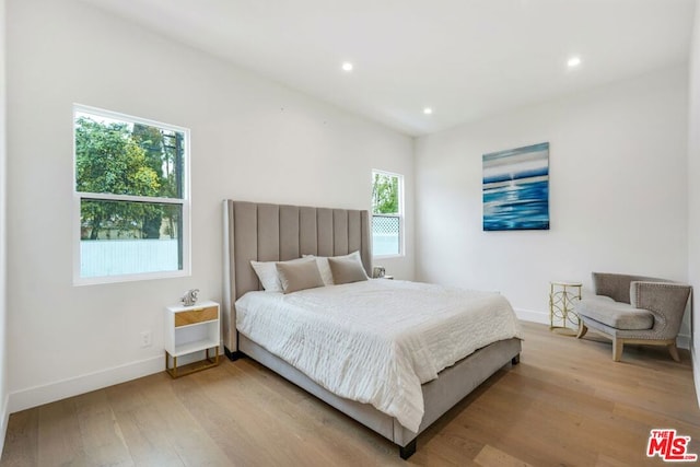 bedroom with light wood-type flooring