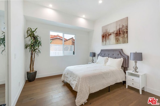 bedroom featuring hardwood / wood-style flooring