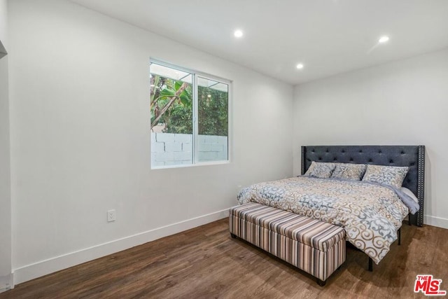 bedroom featuring dark hardwood / wood-style flooring