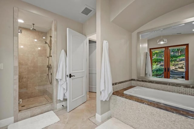 bathroom featuring tile patterned flooring, shower with separate bathtub, vaulted ceiling, and french doors