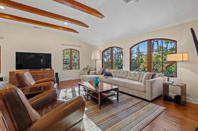 living room with lofted ceiling with beams and wood-type flooring