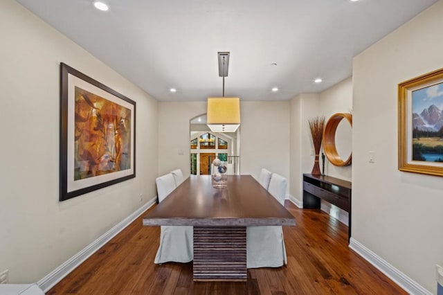 dining room with dark hardwood / wood-style flooring