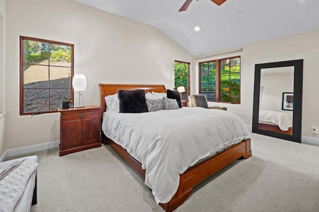 carpeted bedroom with vaulted ceiling and ceiling fan