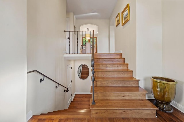 staircase featuring hardwood / wood-style floors