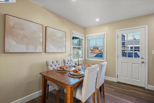 dining area featuring dark hardwood / wood-style floors