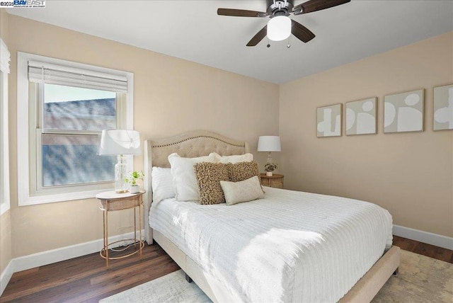 bedroom featuring dark hardwood / wood-style floors and ceiling fan