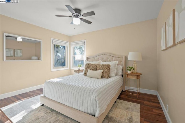 bedroom featuring ceiling fan and dark hardwood / wood-style floors