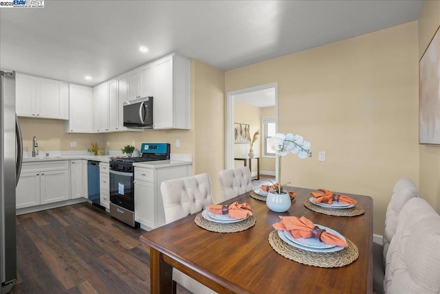 dining area featuring dark hardwood / wood-style floors and sink