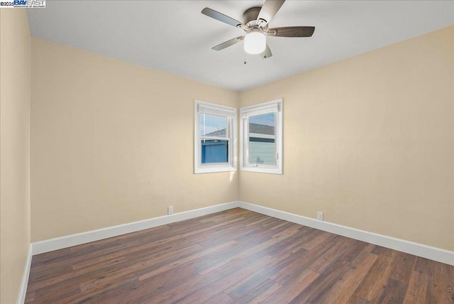 unfurnished room with dark wood-type flooring and ceiling fan