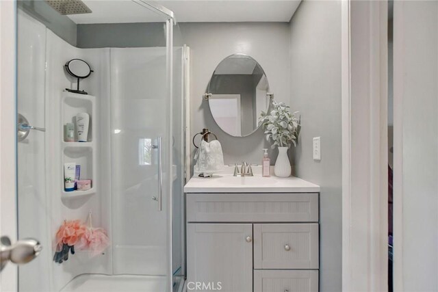 bathroom with vanity and walk in shower