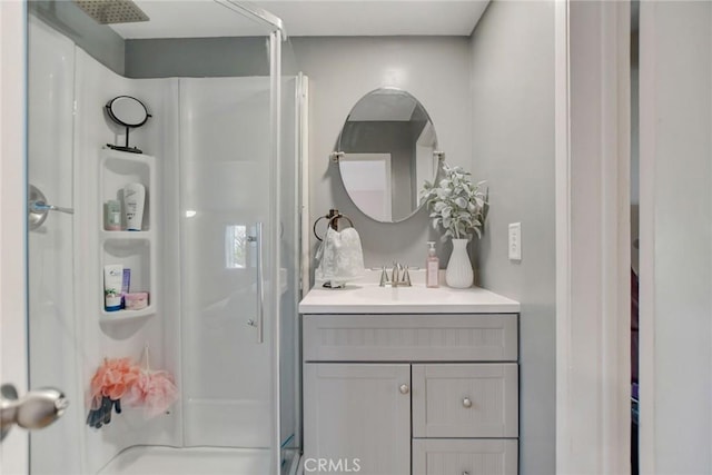 full bathroom with vanity and a shower stall