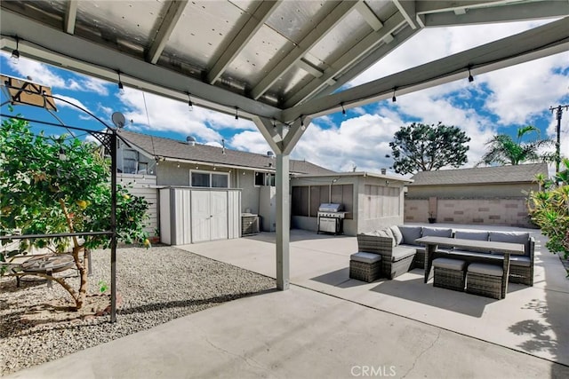 view of patio / terrace featuring an outdoor living space, a gazebo, a storage shed, and a grill