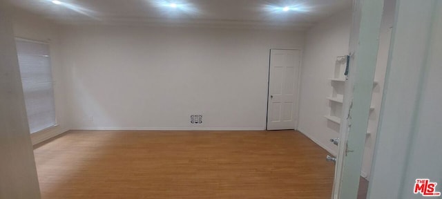 unfurnished room featuring light hardwood / wood-style floors