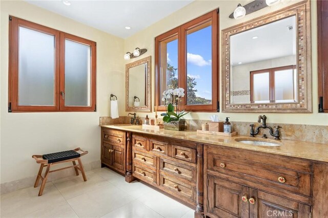 bathroom with tile patterned flooring and vanity