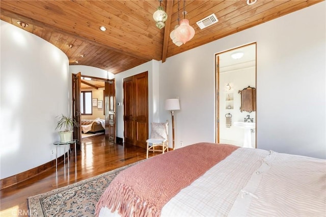 bedroom featuring dark hardwood / wood-style floors, lofted ceiling, connected bathroom, and wooden ceiling