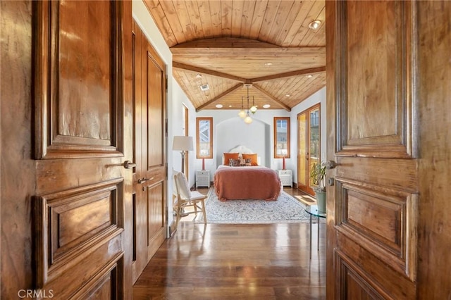 unfurnished bedroom featuring lofted ceiling with beams, wooden ceiling, and dark hardwood / wood-style flooring