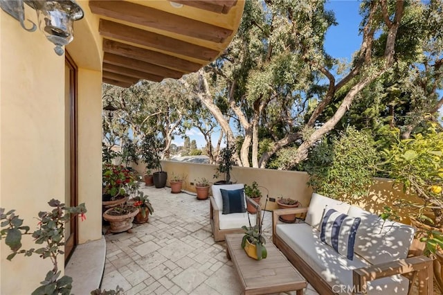 view of patio / terrace with fence and an outdoor hangout area