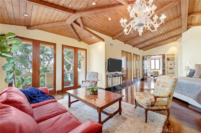 living area featuring vaulted ceiling with beams, wooden ceiling, wood finished floors, and a chandelier