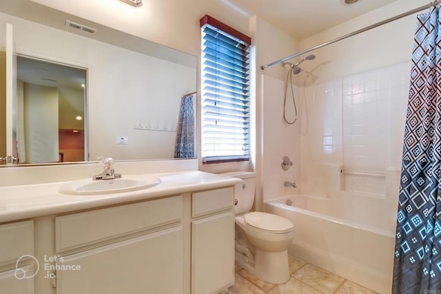 full bathroom featuring vanity, shower / bath combo, tile patterned floors, and toilet