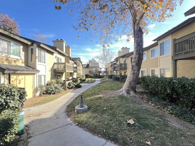 view of home's community with a yard