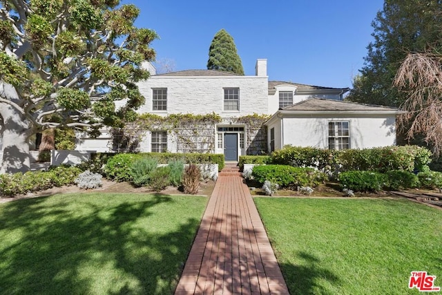 view of front of house with a front yard