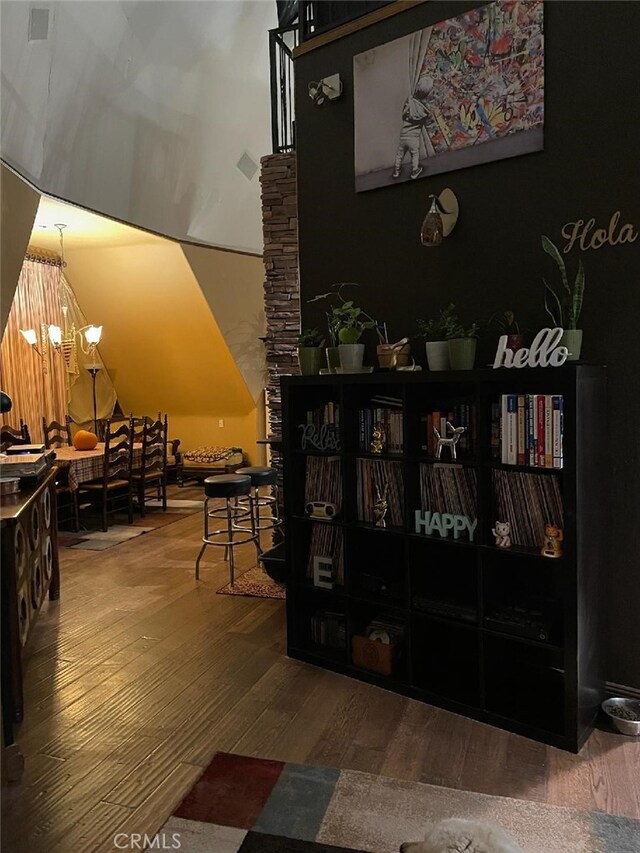 interior space featuring an inviting chandelier and hardwood / wood-style flooring