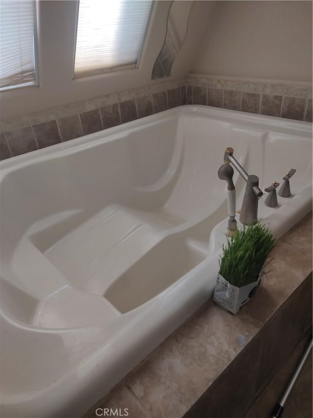 bathroom featuring a tub