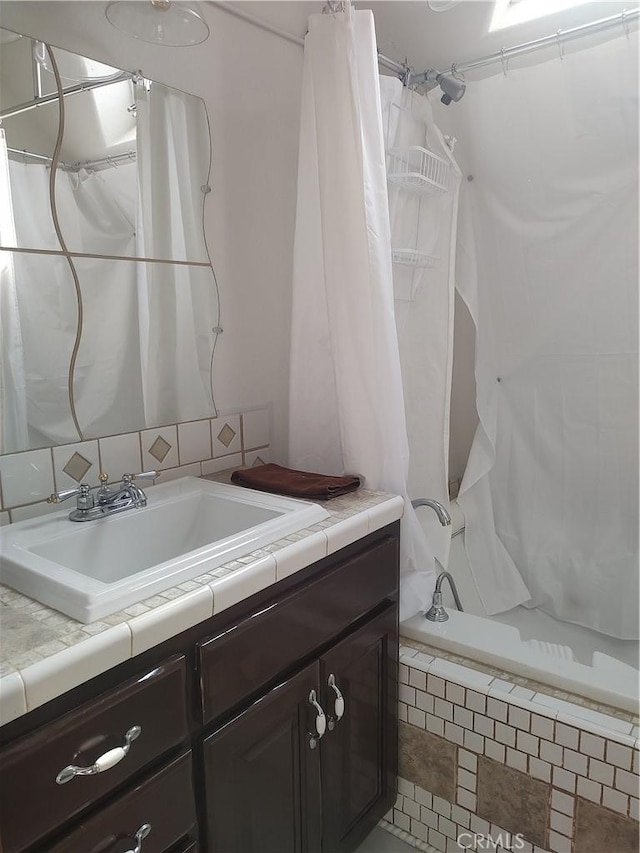 bathroom with vanity and a shower with shower curtain